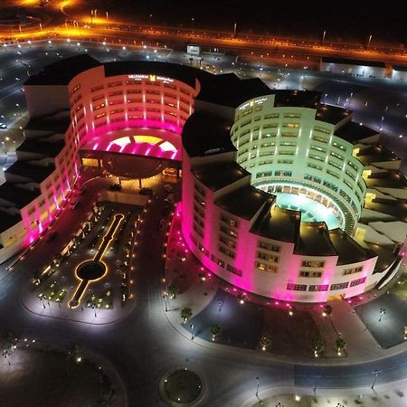 Millennium Hail Hotel Exterior photo Aerial view of the complex