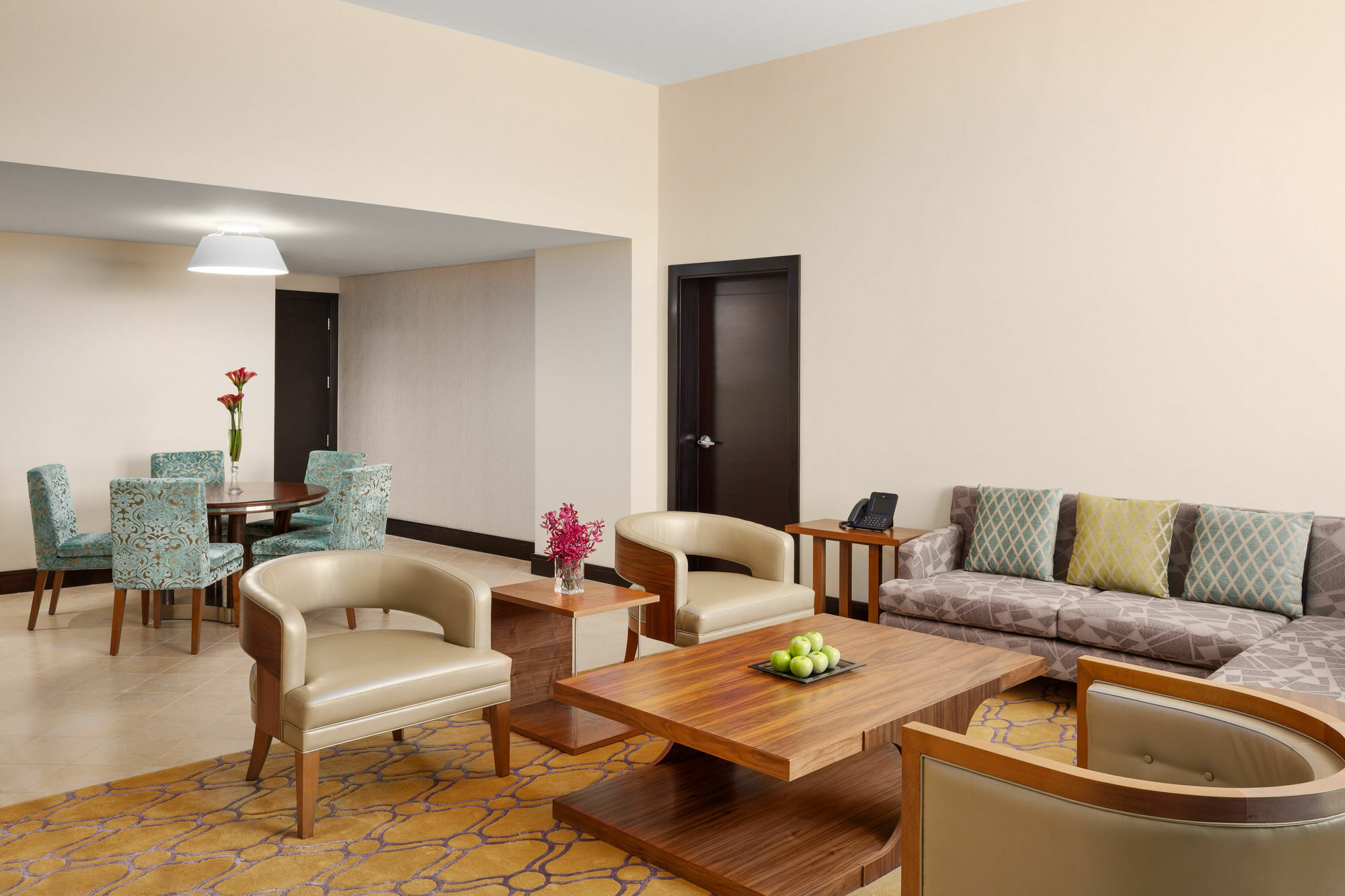 Millennium Hail Hotel Exterior photo A living room in a suite at the hotel